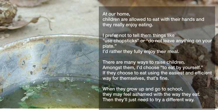 At our home, 
children are allowed to eat with their hands and
they really enjoy eating. 

I prefer not to tell them things like
"use chopsticks" or "do not leave anything on your plate."
I’d rather they fully enjoy their meal. 

There are many ways to raise children.
Amongst them, I’d choose "to eat by yourself."
If they choose to eat using the easiest and efficient way for themselves,
that’s fine.   

When they grow up and go to school,
they may feel ashamed with the way they eat.
Then they’ll just need to try a different way.